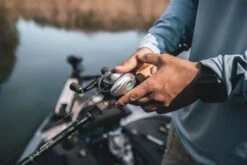 Quantum Energy S3 Baitcasting Reel 16 Quantum Energy S3 Baitcasting Reel -Famous Fishing Store energy bc reel and rod closeup lifestyle